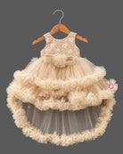 Beige cream net party frock for girls featuring sequin floral embroidery, sleeveless bodice, and tiered ruffle high-low hem design