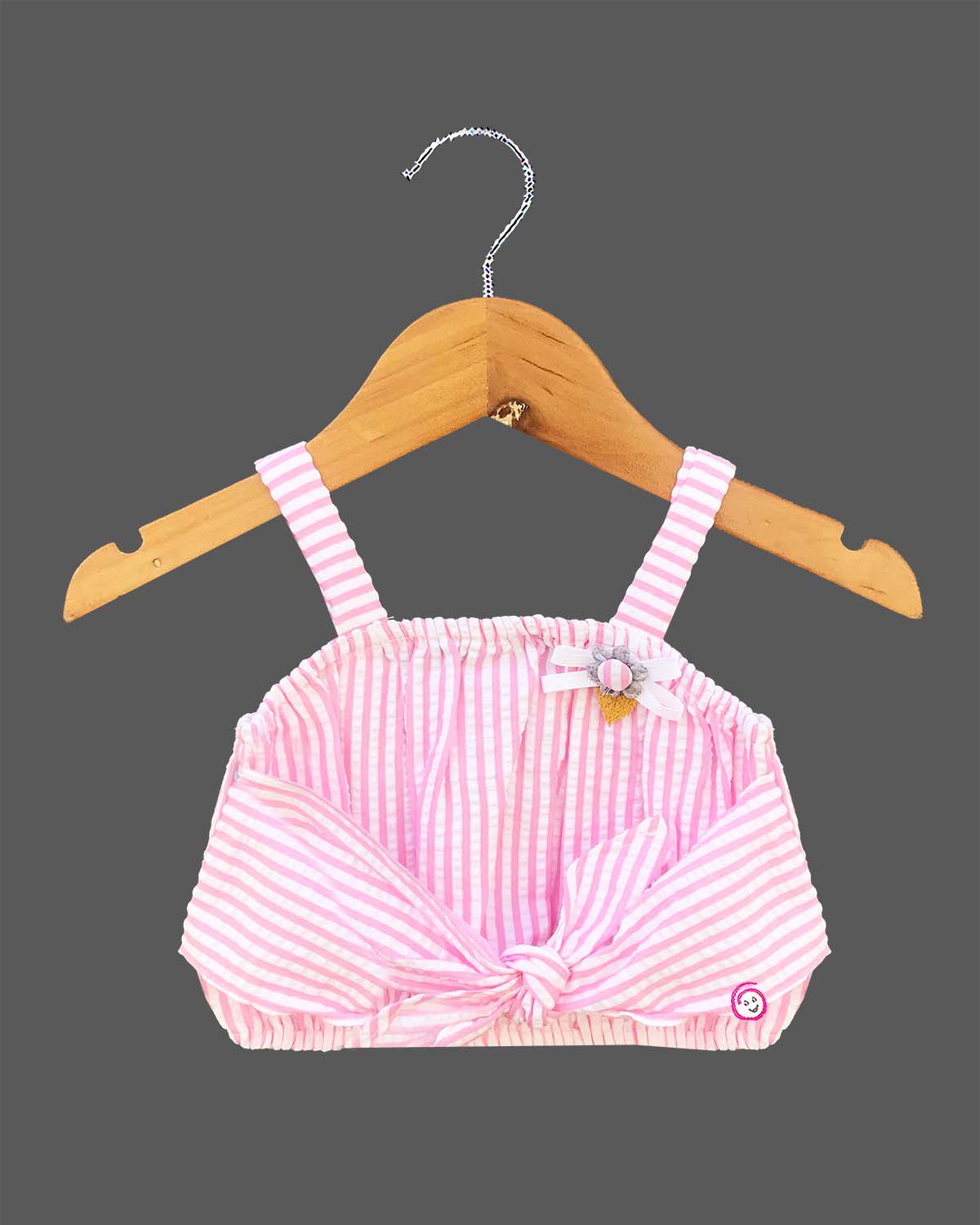 Trendy striped two-piece set for baby girls featuring a sleeveless front-knot crop top with appliqué bow alongside a matching lace-trimmed tiered flared skirt on a hanger.
