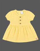 Infants frock in soft textured cotton fabric for casual playdates and baby clothes collection.