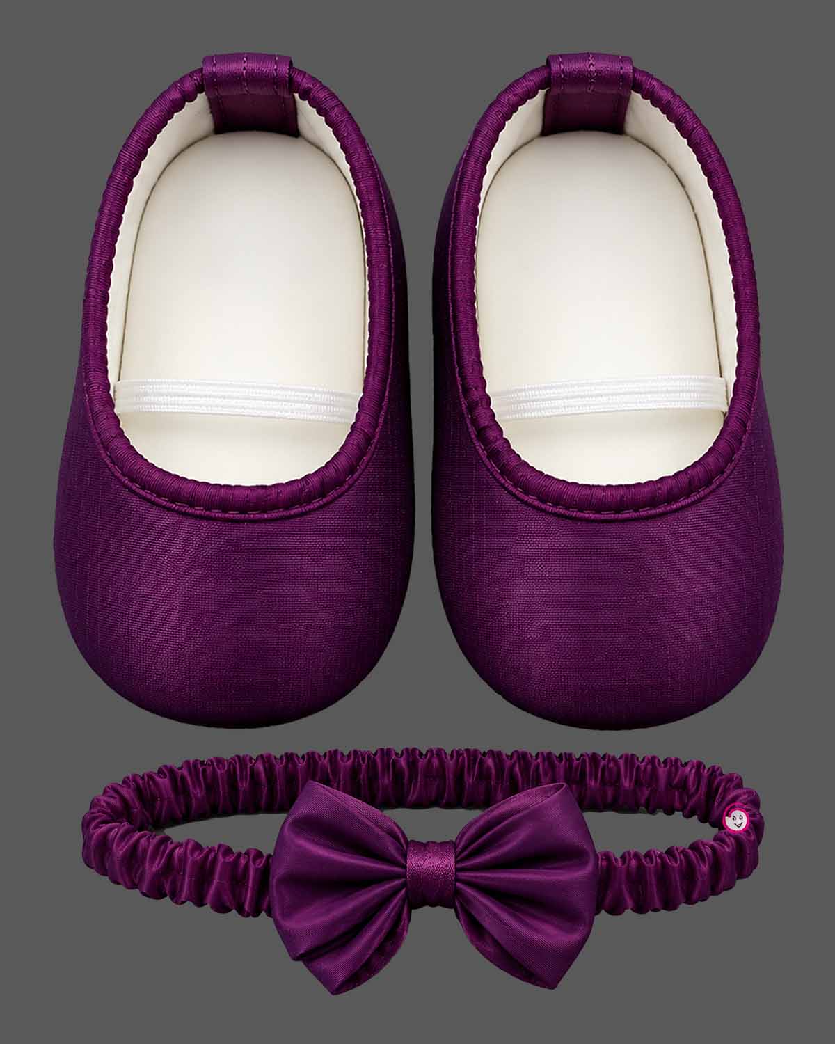 Baby party wear dress featuring a sleeveless satin fit and flare silhouette with front oversized bow and booties set.