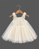 Cream Little Girl Tulle Party Frock with Polka Dots, Flower Details, and Square Neck on Hanger.