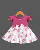 Toddler girl floral tiered frock with ruffled flutter sleeves, waist bow accent, and tiered flared skirt.