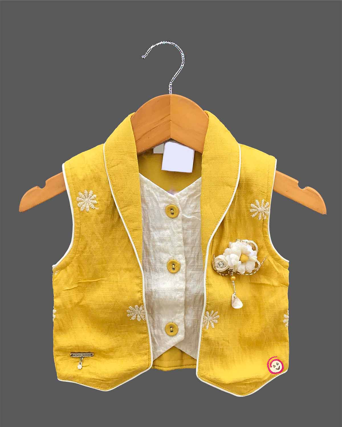 Baby girl in a stylish sleeveless western top and matching embroidered skirt set