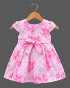 Girls floral box pleated frock with cap sleeves, round neck, and embellished buckle waist belt.