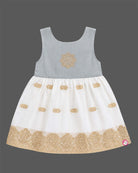 Sleeveless traditional festive attire for toddlers styled with metallic border motifs and chest embroidery.