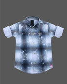 Toddler boy wearing blue and white check shirt with rolled up full sleeves for casual outing