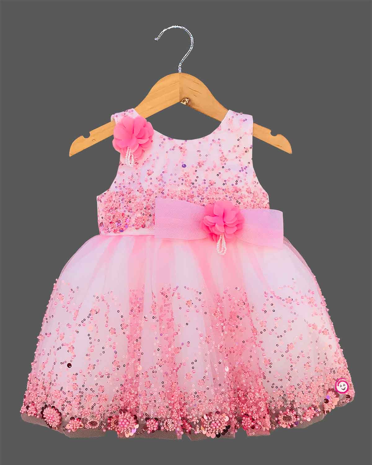 Baby pink sequin floral embroidered net party frock with waist bow for baby girls grand celebrations, temple visits, and family festivals
