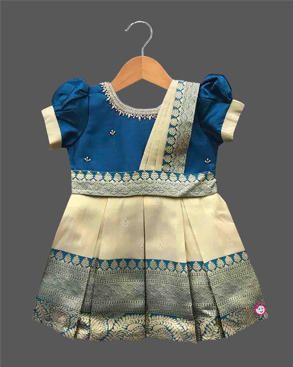 Baby girl silk blend traditional frock featuring zari border and puff sleeves for cultural events