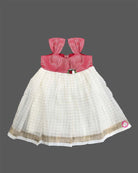 Toddler traditional ethnic wear frock with woven Kasavu pattern and floral detail for festivals.