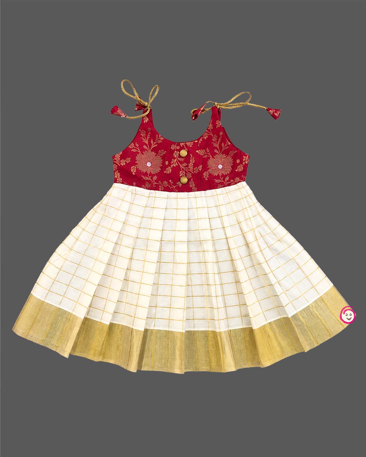 Little princess wearing traditional Kasavu pleated frock with floral brocade bodice for festive celebrations