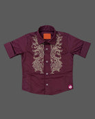 Boys party wear embroidered button-down shirt with spread collar and roll-up sleeves.