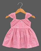 Toddler floral embroidered muslin frock with pleated cap shoulder straps and gathered A-line flared skirt.