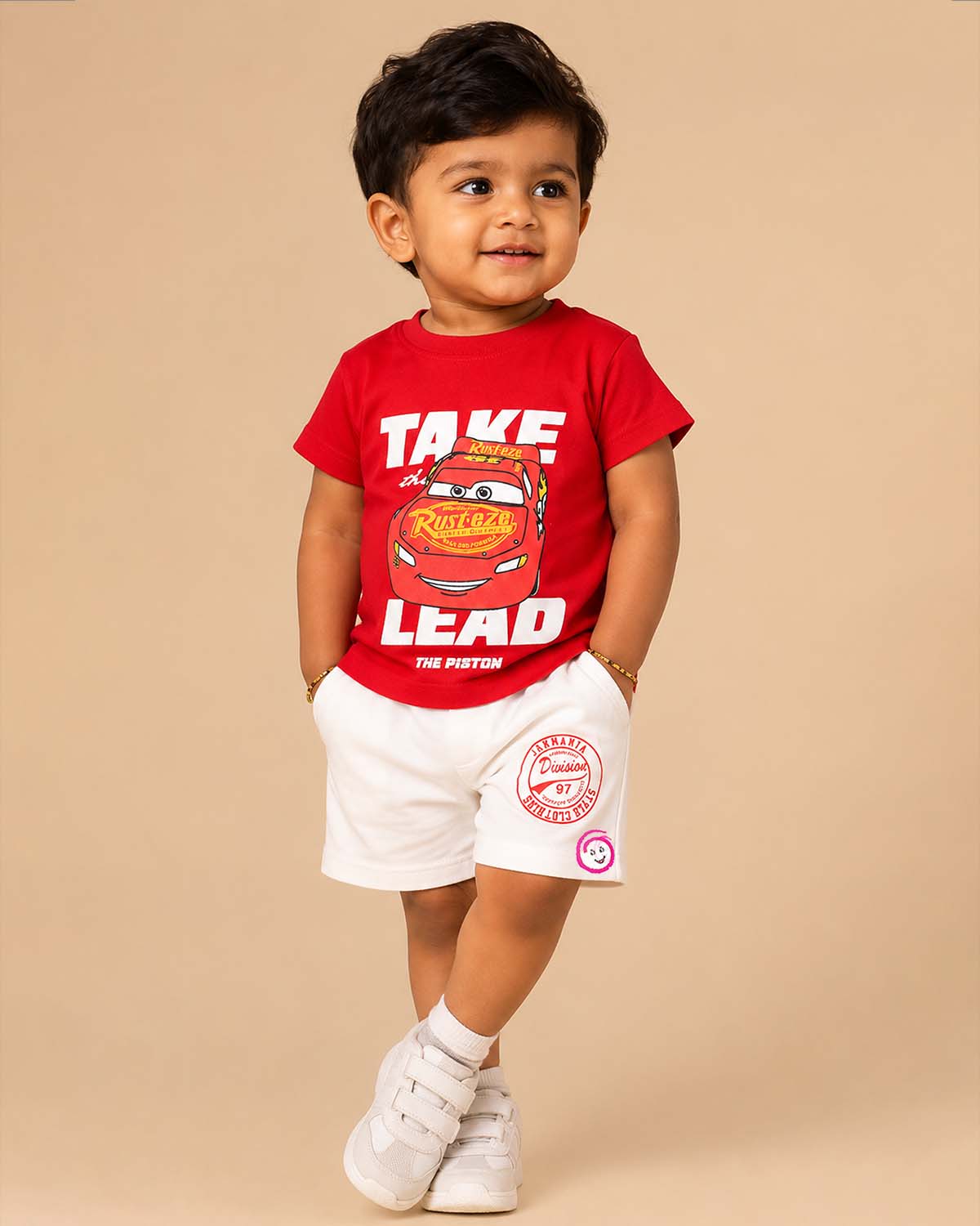 Red graphic t-shirt with racing car print and white elasticated shorts baby boy top and shorts set for summer vacations, playdates, and park outings