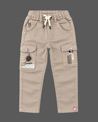 Boys button-down shirt and cargo pant set designed as party wear for boys with tropical print and chest embroidery.