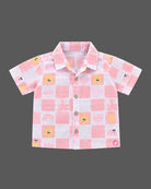 Co-ord set for baby boy featuring a button-down checkered shirt and matching shorts with sun graphics