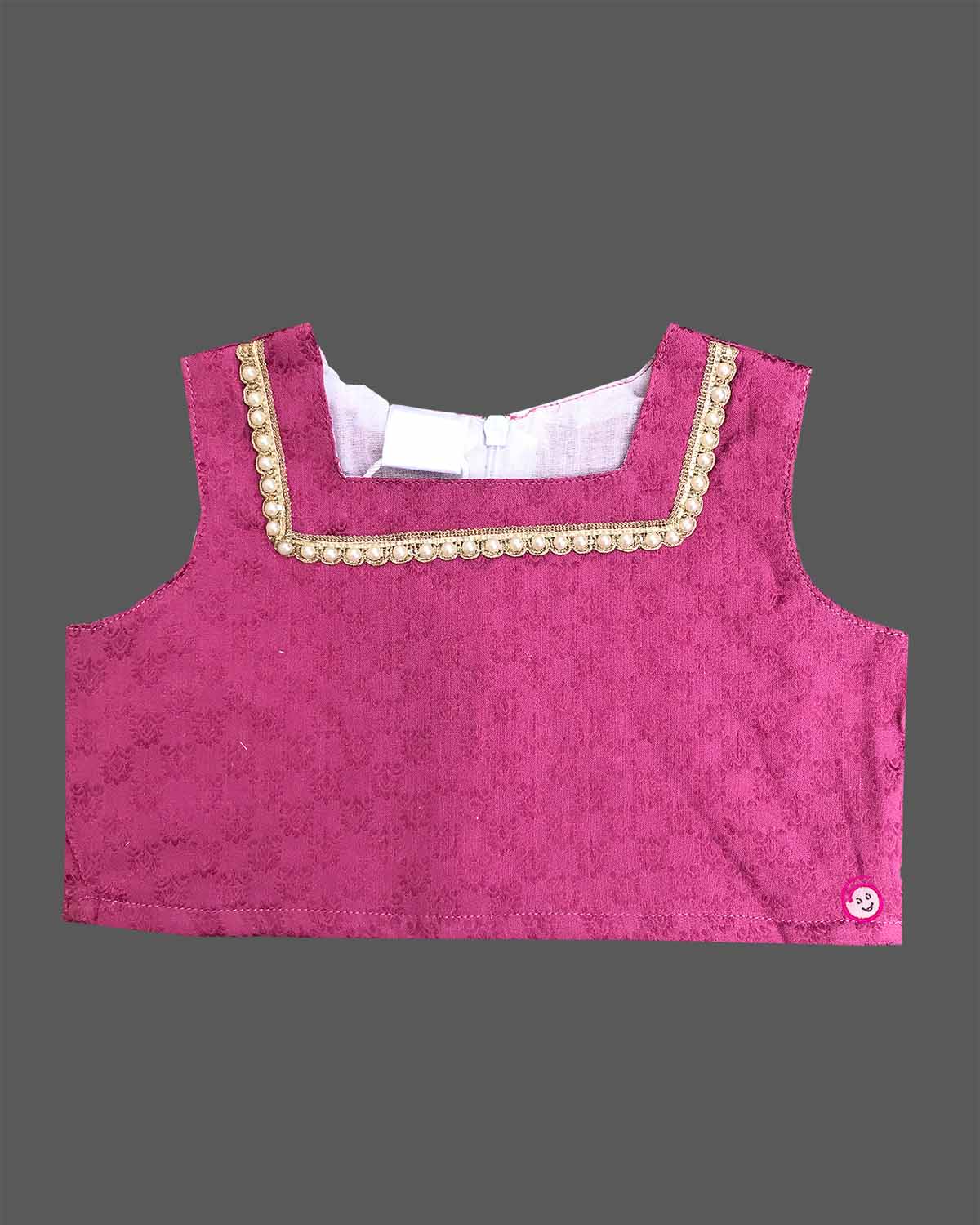Little fashionista traditional two-piece festive choli set with woven zari borders and pleated ethnic skirt.
