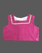 Little fashionista traditional two-piece festive choli set with woven zari borders and pleated ethnic skirt.