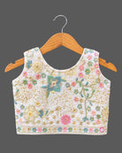 Hand-embroidered lehenga choli for kids with sleeveless choli, flared skirt, and dupatta.
