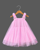 Little princess pink net frock with shimmer tulle overlay and floral shoulder embellishments for party wear