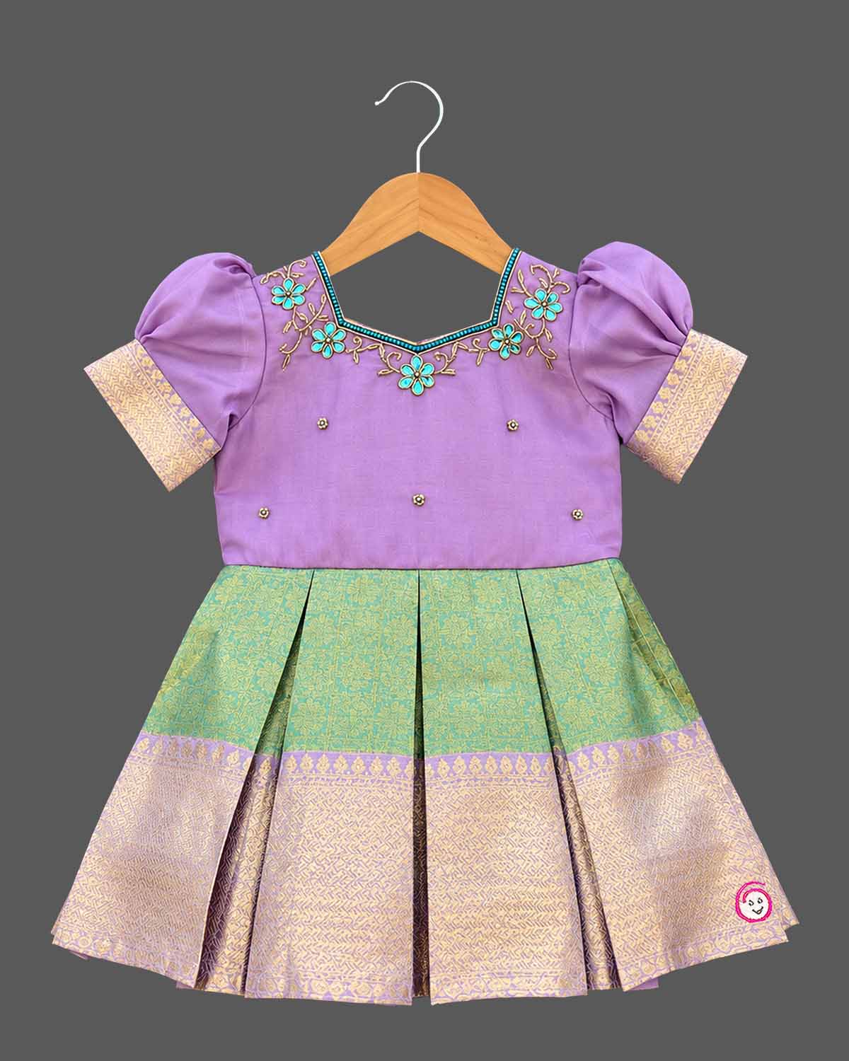 Pattu frock for girls with floral embroidered yoke, puff sleeves and zari border box-pleated skirt