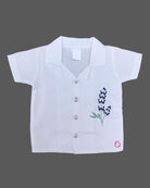 Short sleeve notch collar shirt with floral embroidery on front side paired with solid elastic waist shorts for toddler boys
