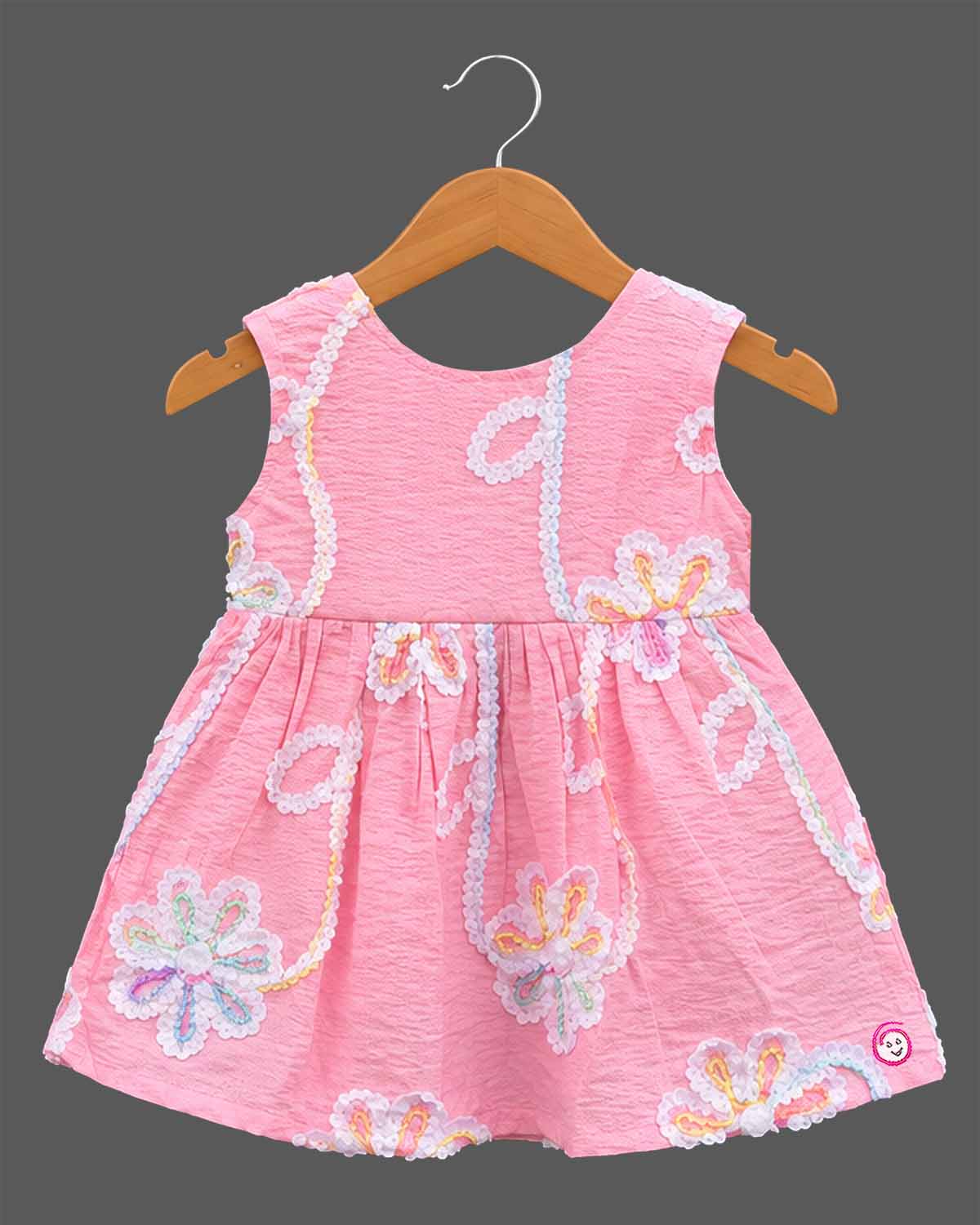 Baby girls sleeveless textured cotton frock with sequin floral embroidery and gathered waistline