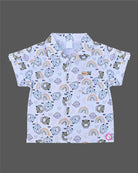 Boys 2-piece cotton casual co-ord set featuring a short-sleeve collared shirt and matching shorts in white with cute teddy bear faces, rainbows, and planet prints