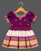 Toddle silk cotton frock  for kids featuring embroidered  puffed sleeves, and woven pleated skirt.