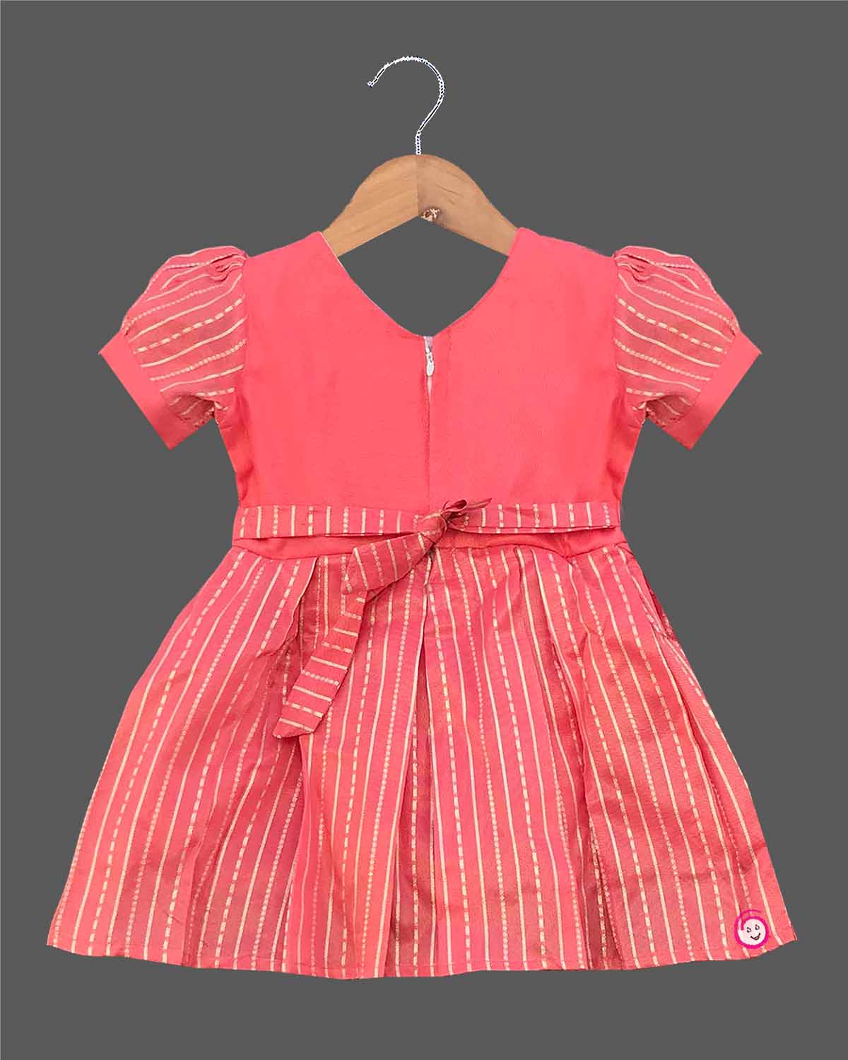 Infant cotton silk frock in peach pink with gold zari work and neckline embroidery for ear piercing ceremonies, festivals, temple visits, and weddings  
