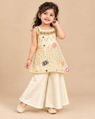 Girls Silk Sharara Set featuring floral embroidered short kurti with wide flared sharara pants for festive wear