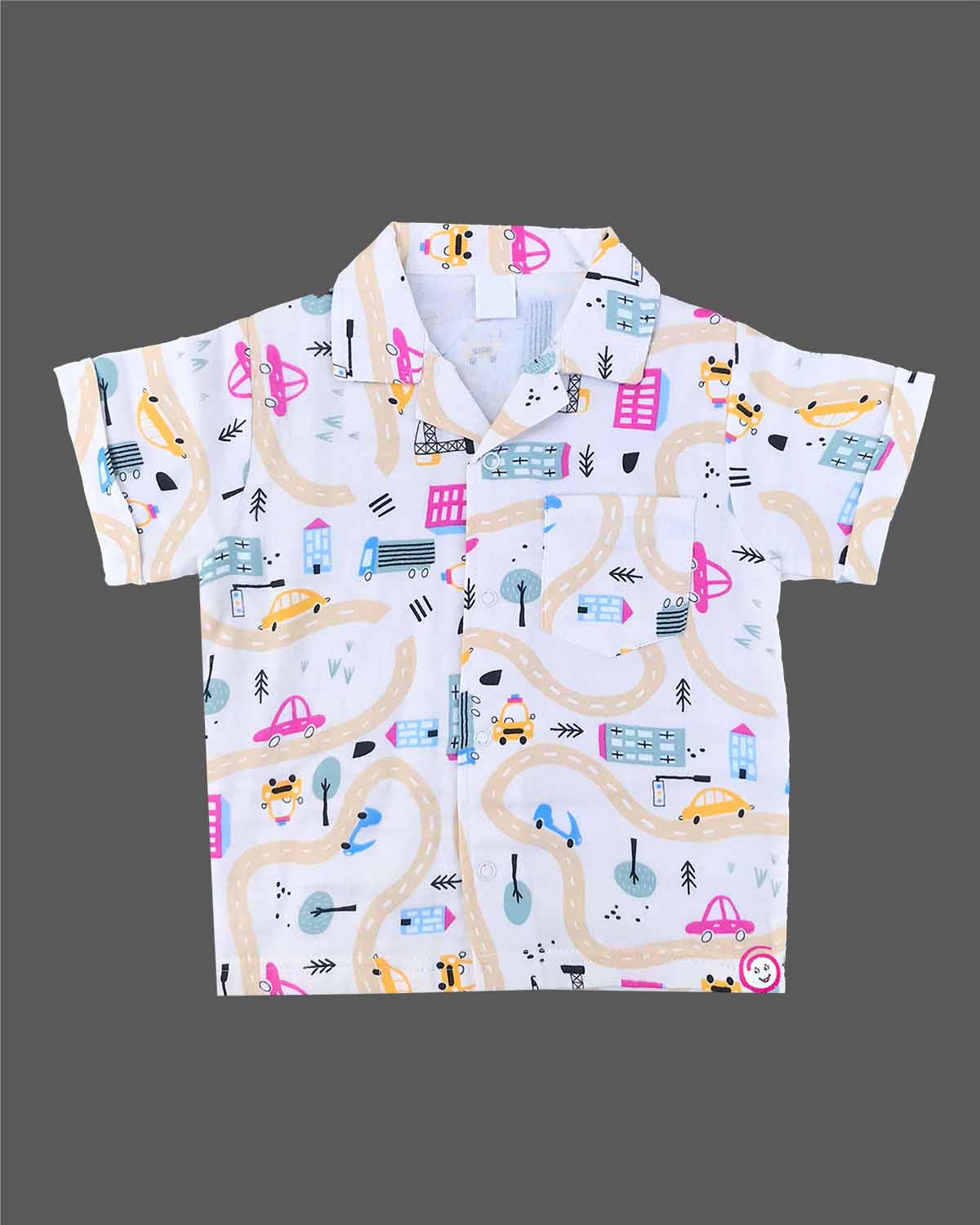 Boys 2-piece cotton casual co-ord set featuring a short-sleeve collared printed shirt and matching shorts in white with colorful cars, roads, and buildings print