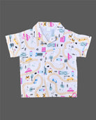 Boys 2-piece cotton casual co-ord set featuring a short-sleeve collared printed shirt and matching shorts in white with colorful cars, roads, and buildings print