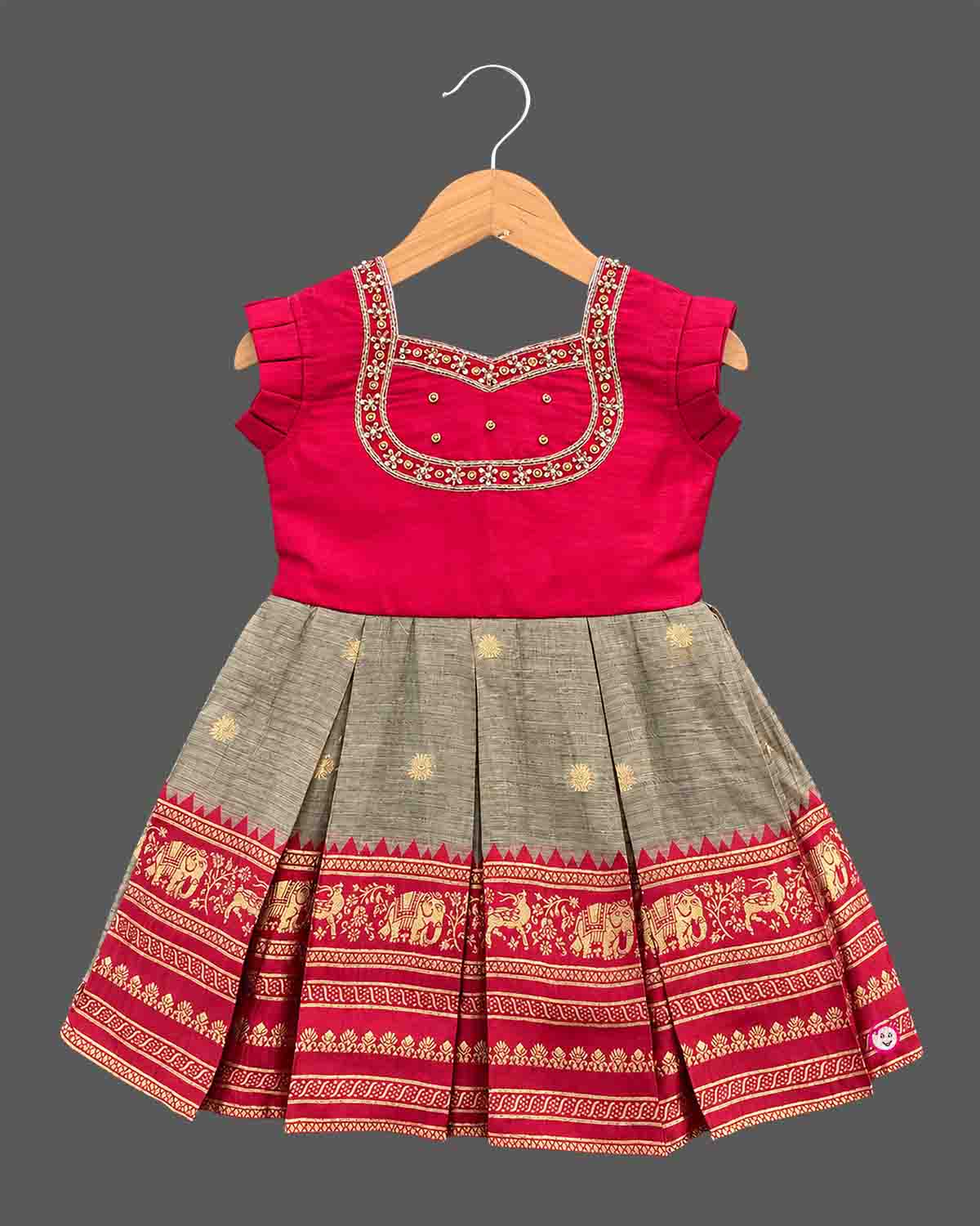 Girls silk blend embroidered box pleated frock with zari neckline detail and woven elephant motif border for kids