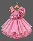 Toddler girl ruffled organza party frock featuring asymmetrical butterfly ruffles and matching bow headband