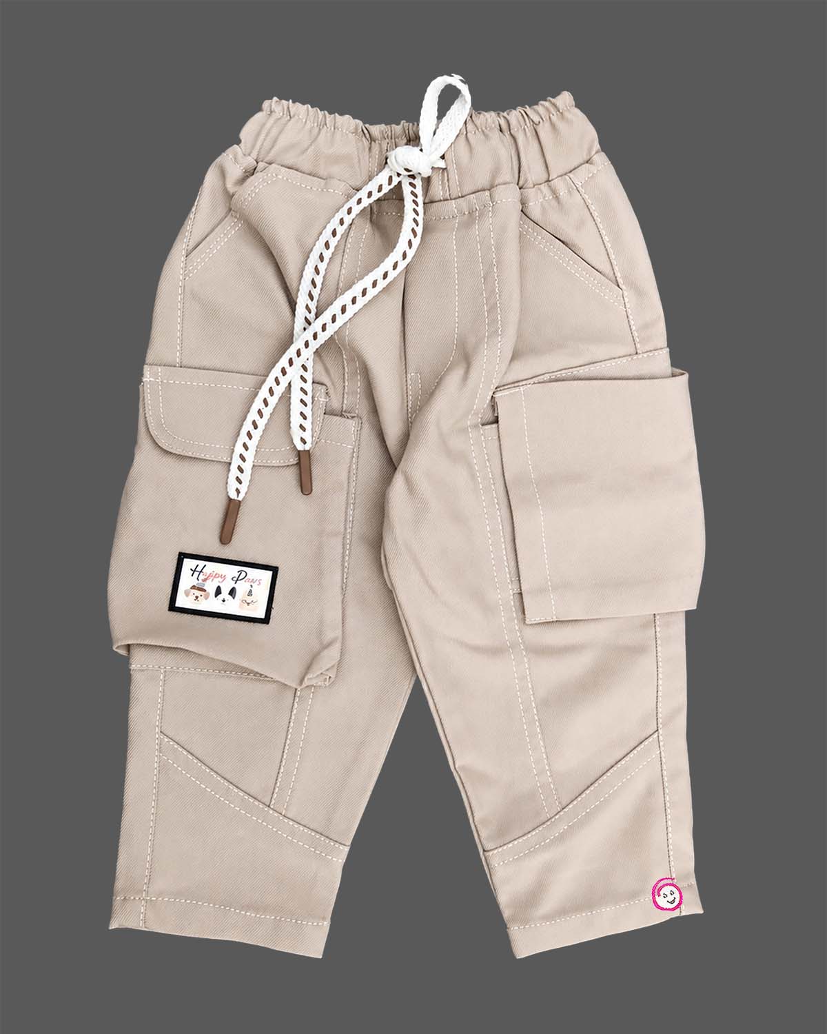 Casual utility cargo pants for little gentleman detailed with contrast stitching panels, large side flap pockets, and a patterned rope drawstring.