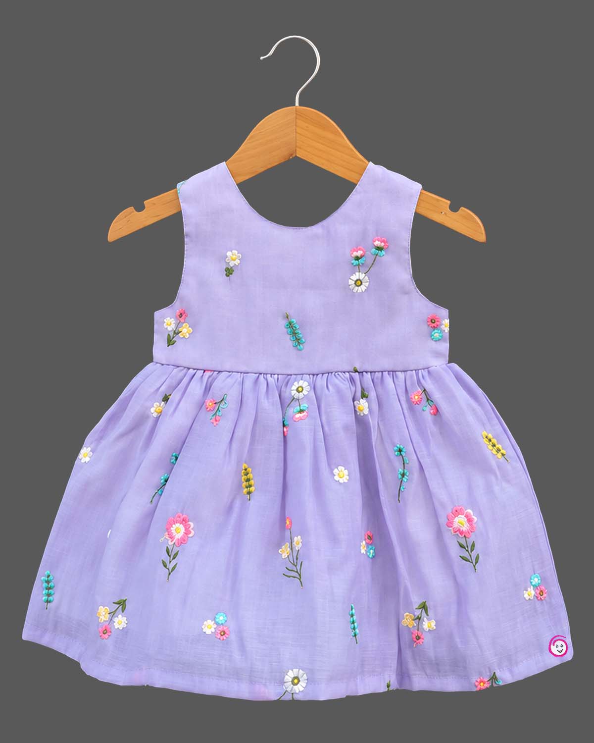 Sleeveless organic cotton frock with embroidered floral details and kurti for kids styling.