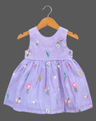 Sleeveless organic cotton frock with embroidered floral details and kurti for kids styling.