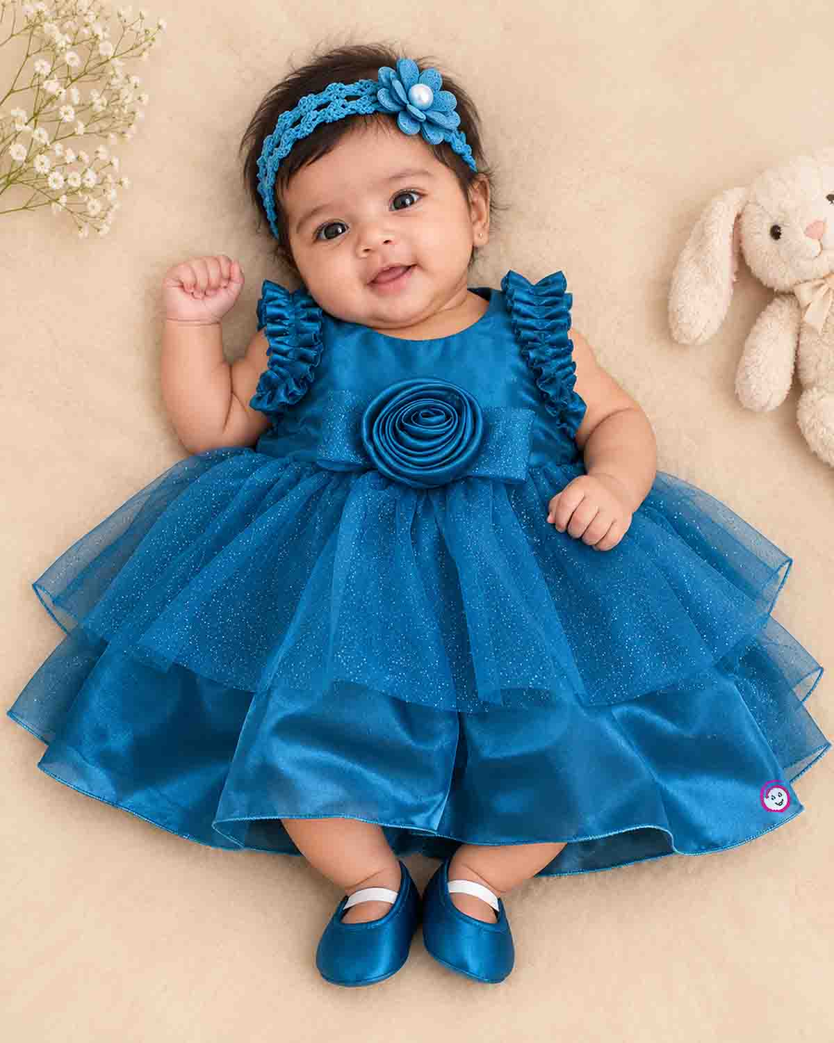 Teal blue shimmer net party frock for toddler girls with ruffled shoulders and center rose flower detail