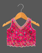 Detailed view of sleeveless embroidered lehenga choli for kids featuring scalloped floral hems.