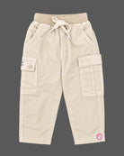 Toddler wearing checkered button-down shirt and pant designed as western dress for boys.