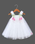 Off white net party frock with pink tulip floral accents and strap bows for girls