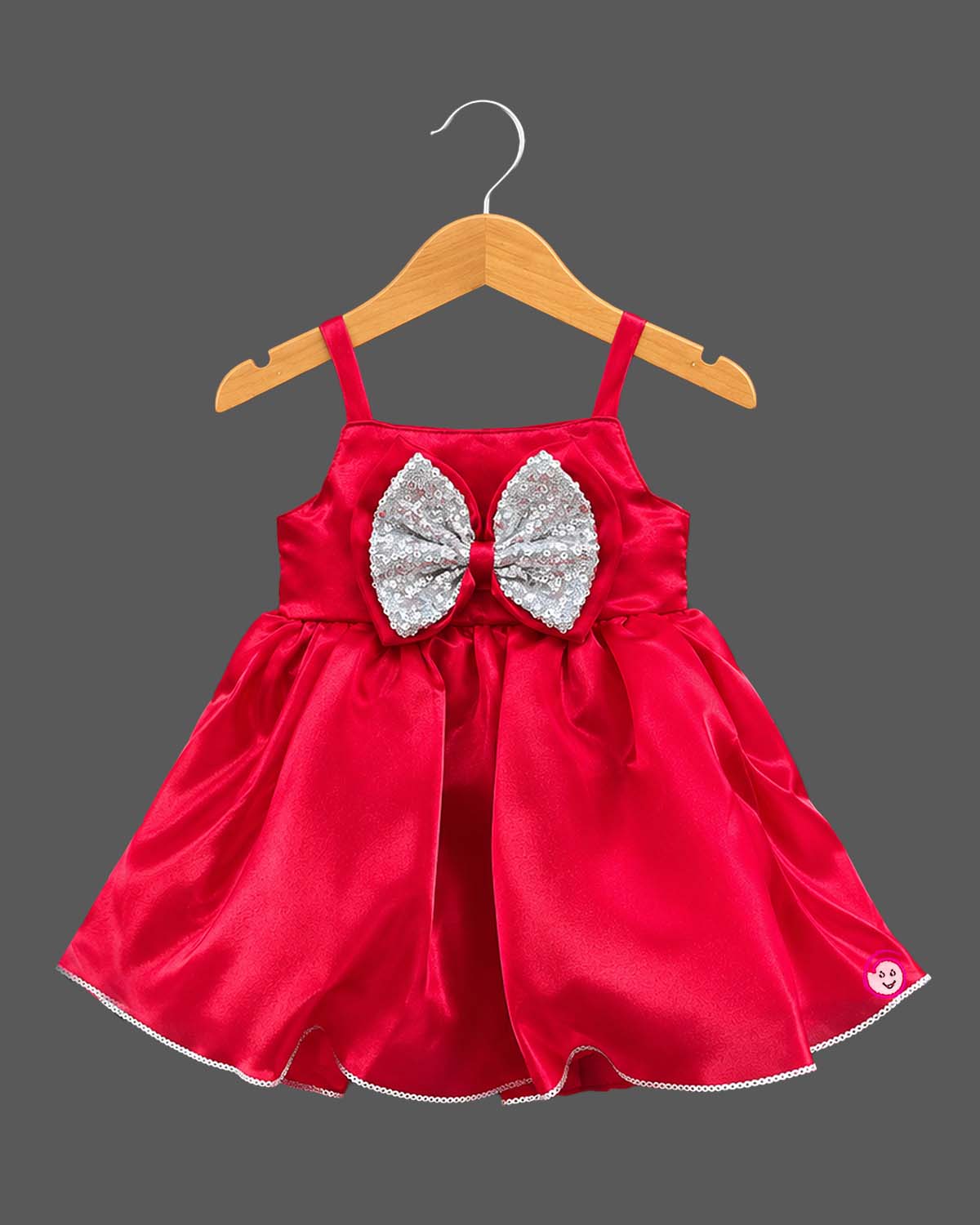 Toddler satin party dress featuring a sequin bow accent and sleeveless straps