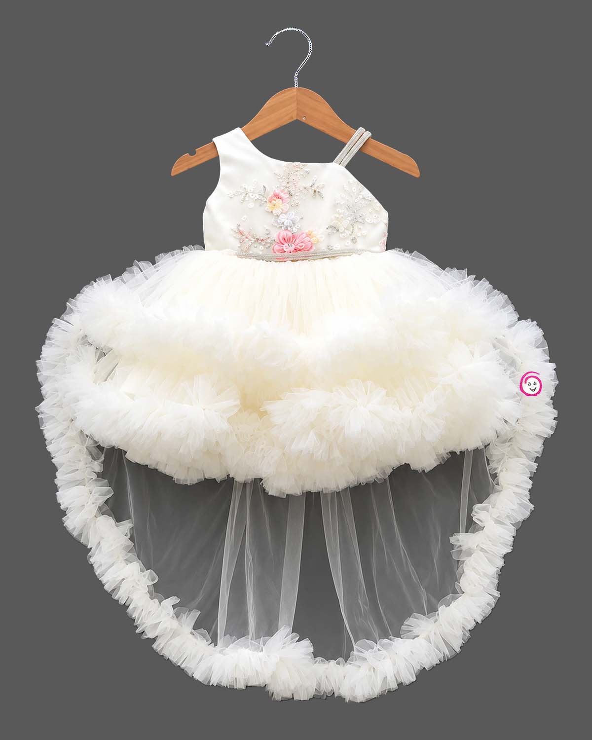 Embellished asymmetrical tulle silk frocks for baby girl featuring ruffled high-low hem.