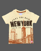 Light yellow graphic t-shirt with New York cityscape print and rust orange elasticated shorts baby boy top and shorts set for summer vacations, playdates, and park outings