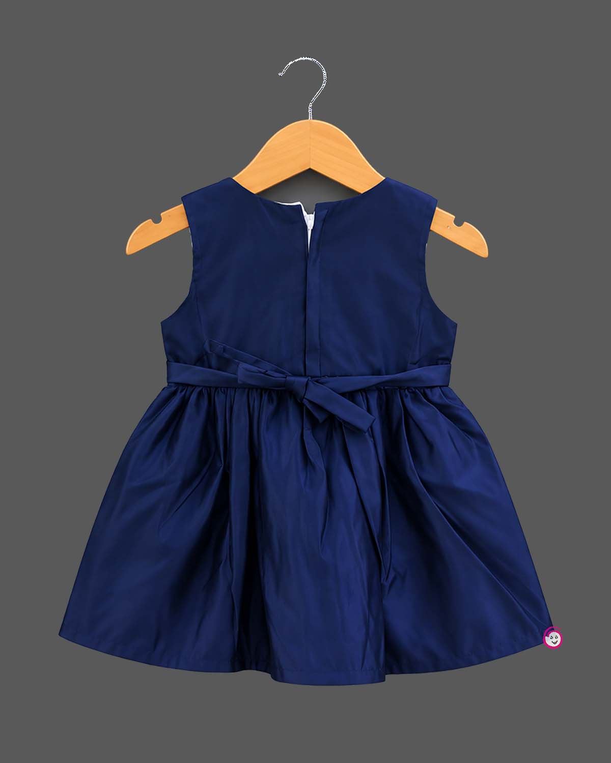 Sleeveless A-line frock with sequined waist belt and shoulder bow, styled as a baby casual wear dress.