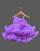 Purple net frock with layered ruffles and floral embellishment for girls