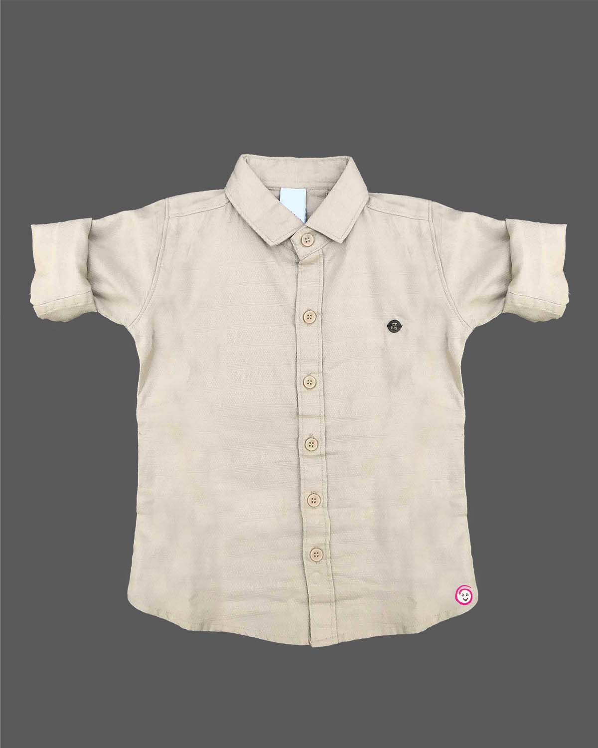 Sophisticated toddler boys button-up shirt featuring subtle micro-patterns with a small chest patch and roll-up sleeves.