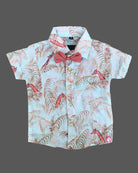 Dapper toddler boys ethnic ensemble featuring a collared printed shirt with a bow tie and matching suspender shorts.