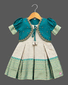 Infant silk frocks for baby girl featuring layered puffed sleeves, and ornate pleated brocade skirt.