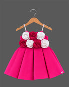 Hot pink satin party frock for girls with white and magenta floral rose appliques and embellished shoulder straps
